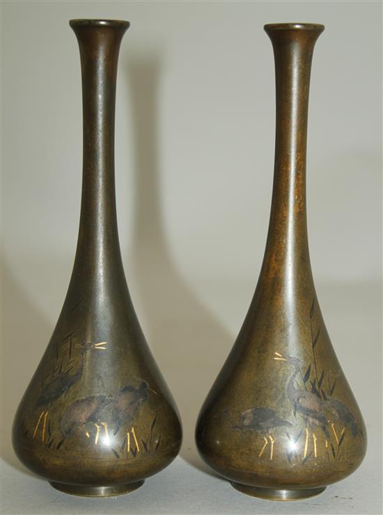 A pair of Japanese silver and gold inlaid bronze small bottle vases, Meiji period, 14cm